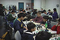 Roman Pelts FIDE trainer and a class of students